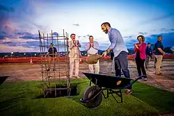 Nayib Bukele casts the first stones of the Airport of the Pacific's construction as Fernando Romero and William H. Duncan watch