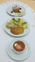Tufahija served with soup and meat loaf