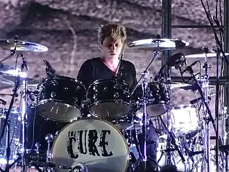 Cooper performing with The Cure in 2013